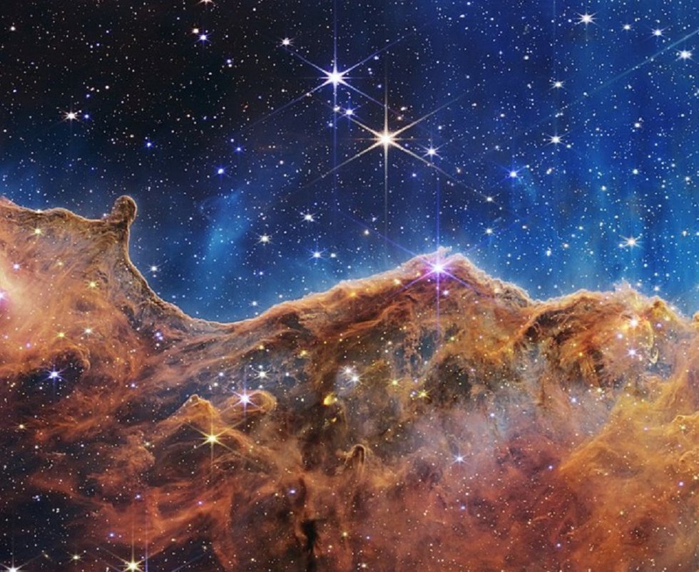 NASA’s_Webb_Reveals_Cosmic_Cliffs,_Glittering_Landscape_of_Star_Birth.jpg